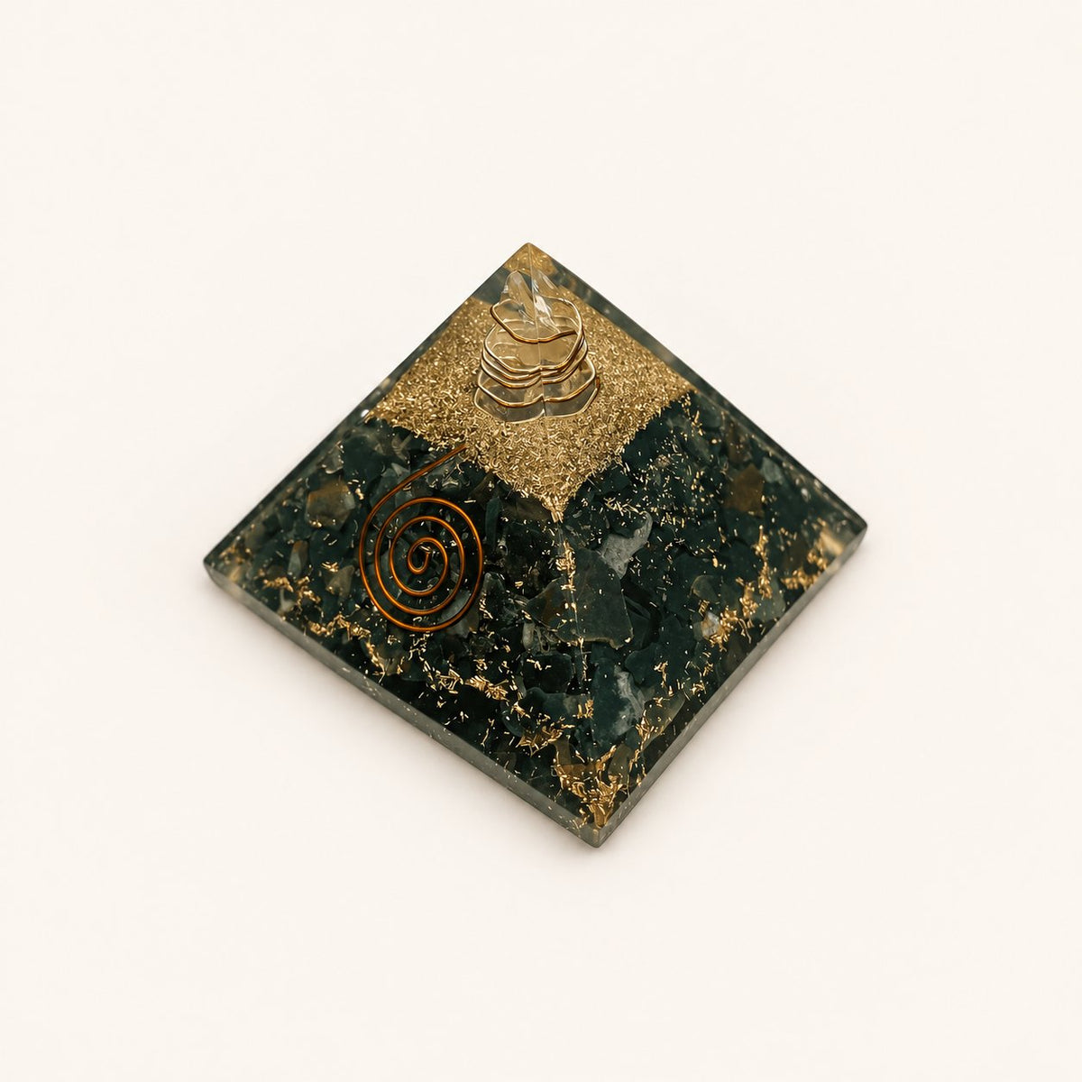 Bloodstone Orgone Pyramid with deep green bloodstone chips and metallic details on a warm ivory background