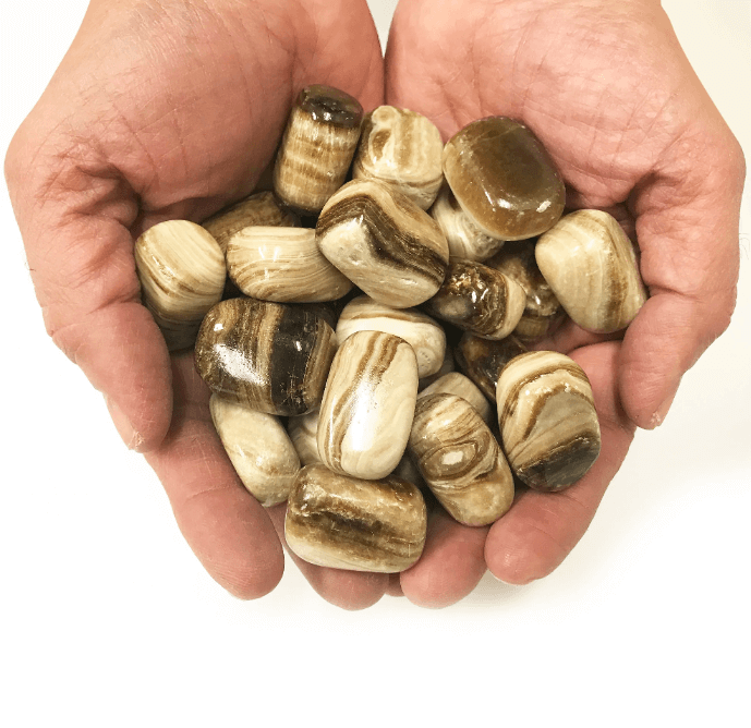 Polished Chocolate Calcite tumbled stones showcasing their rich brown hues and healing properties.