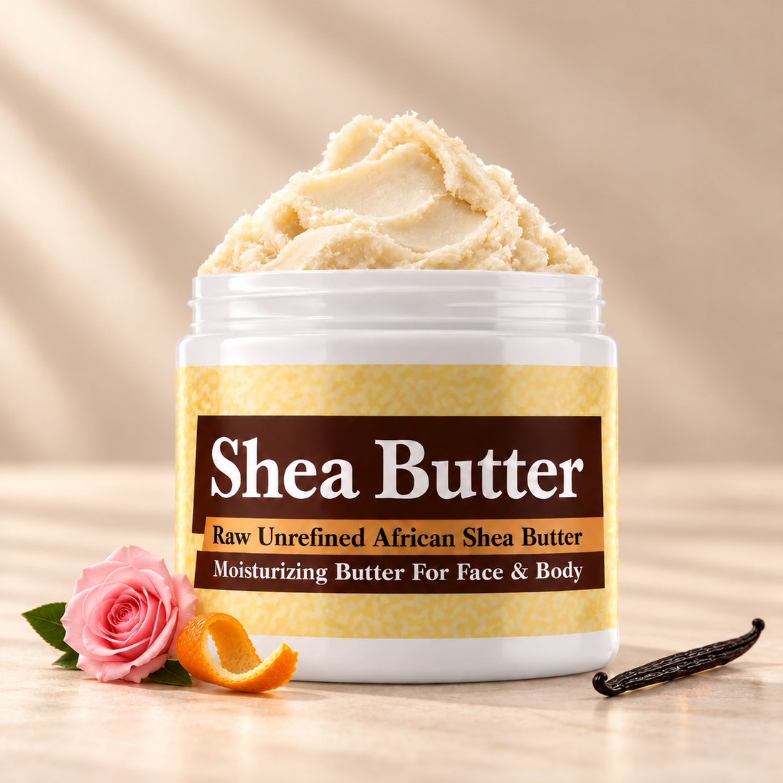 Chanel Mademoiselle inspired shea butter in an open white jar with textured ivory butter and simple orange, rose and vanilla scent accents on a soft cream background.