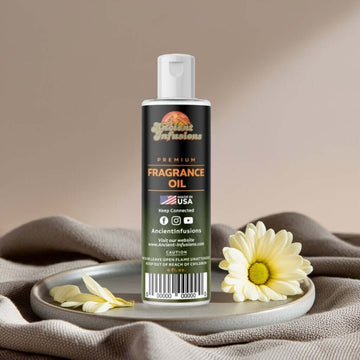 China Musk Fragrance Oil bottle elegantly displayed with daisies on a soft fabric background, showcasing its premium label.