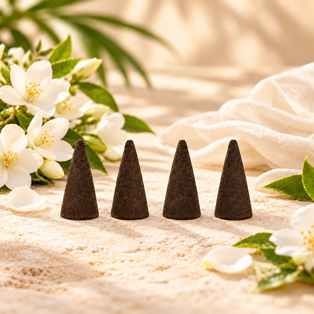 China Rain incense cones with white flowers and ivory cloth.