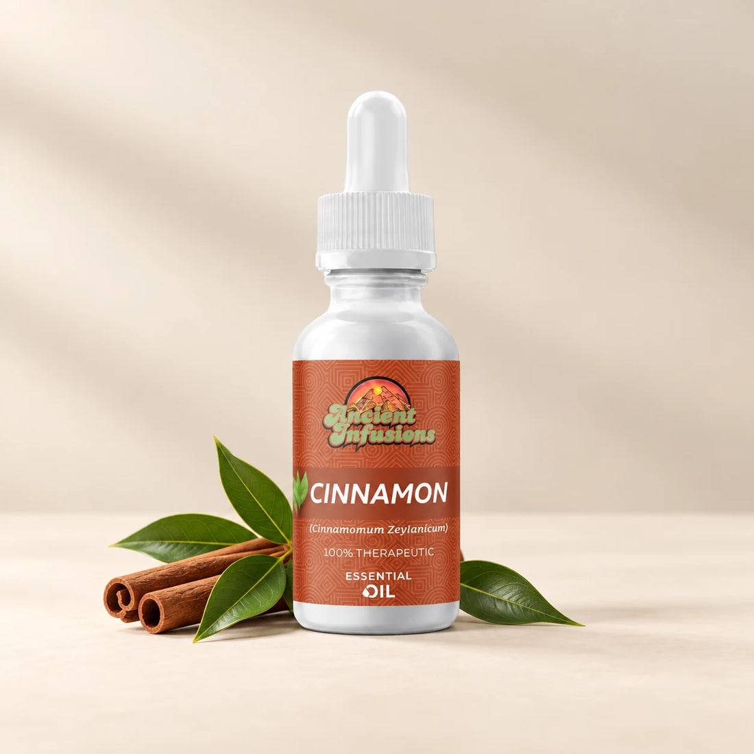 Ancient Infusions Cinnamon Leaf Essential Oil bottle with botanicals on a soft ivory background.