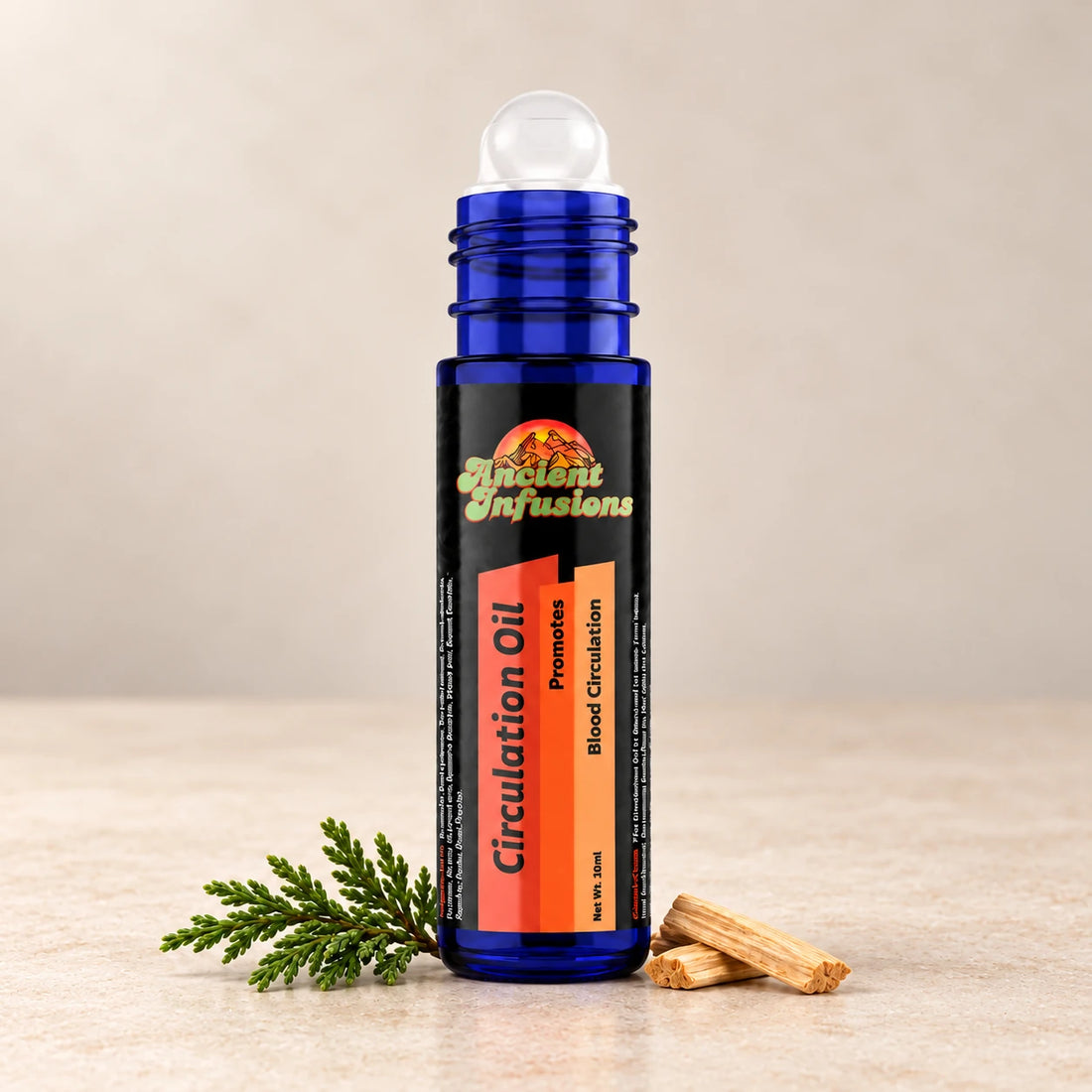 Ancient Infusions Circulation Herbal Remedy Oil Warm & Balance single roller bottle with botanical accents on a soft ivory stone background.