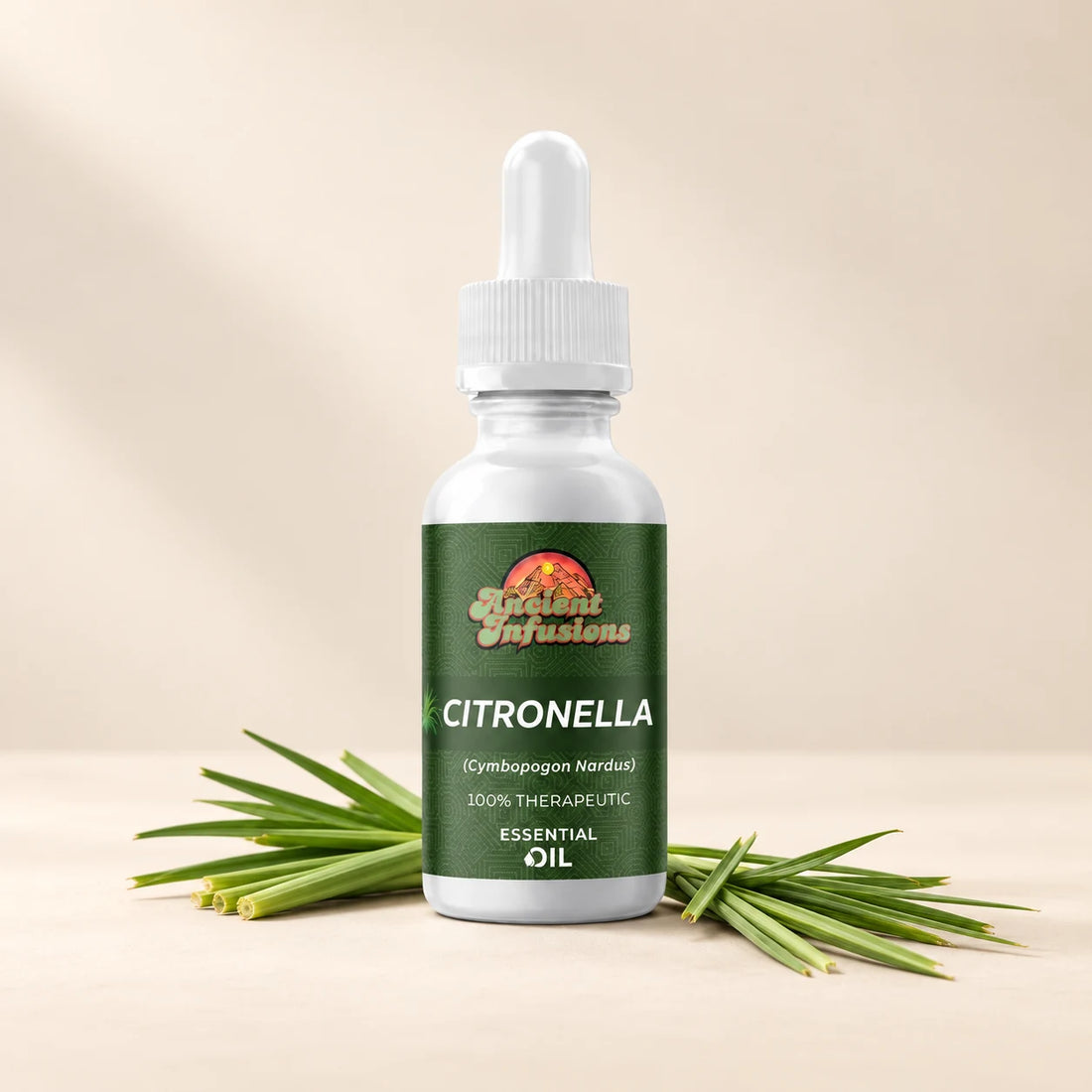 Ancient Infusions Citronella Essential Oil bottle with botanicals on a soft ivory background.
