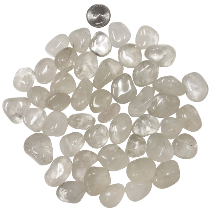 Close-up of polished clear quartz stones, highlighting their spiritual benefits and amplifying energy.