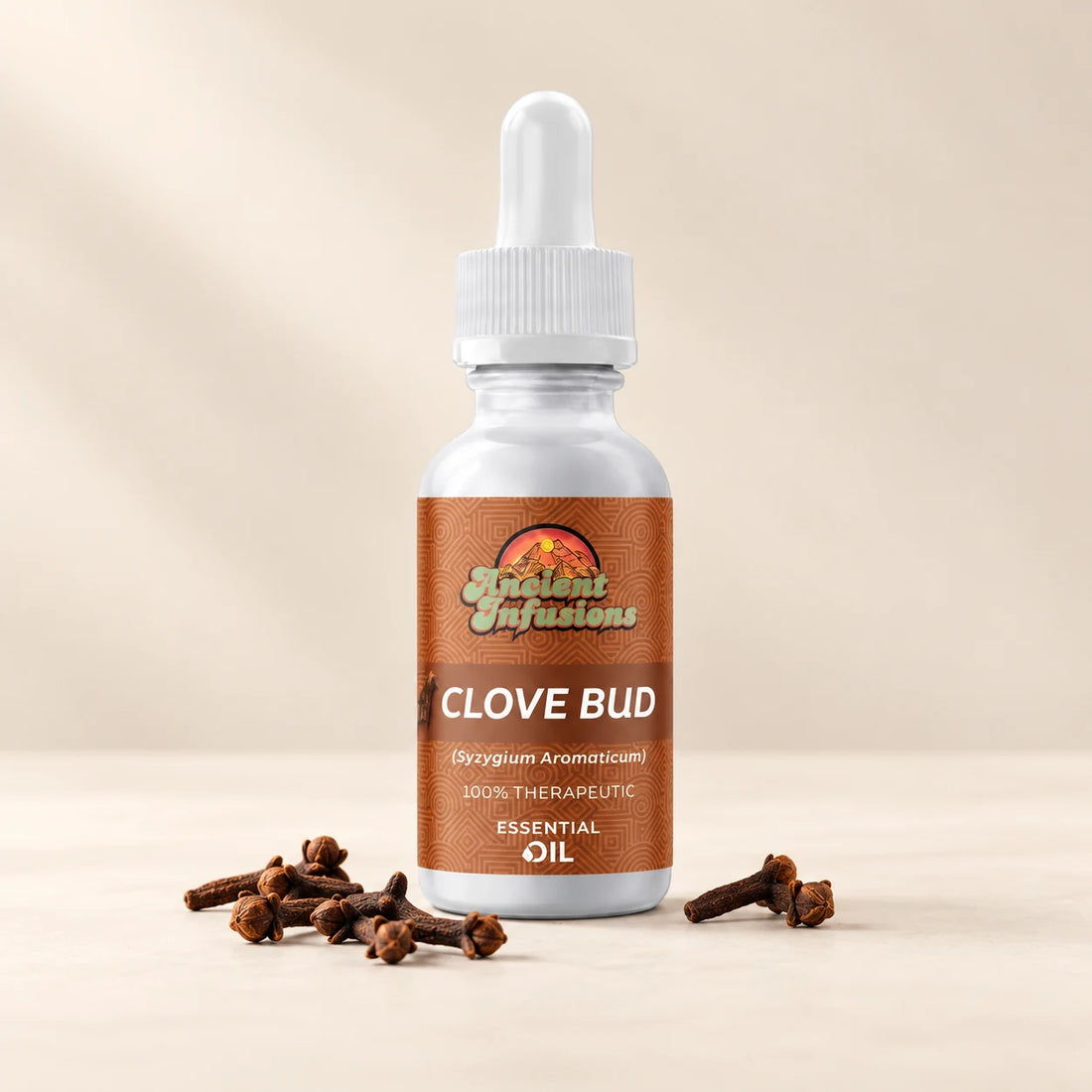 Ancient Infusions Clove Bud Essential Oil bottle with botanicals on a soft ivory background.