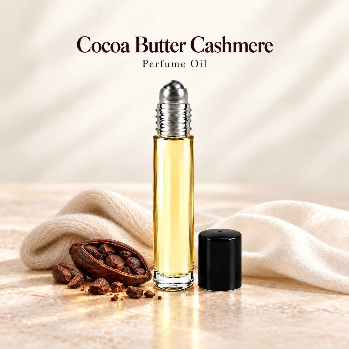 Cocoa Butter Cashmere Perfume Oil with simple scent note accents on soft ivory