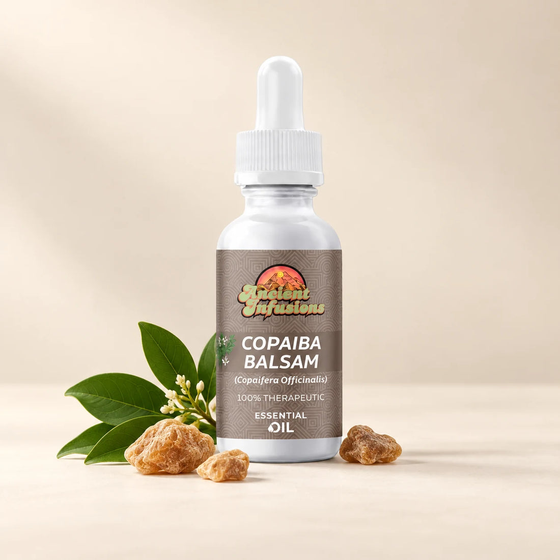 Ancient Infusions Copaiba Balsam Essential Oil bottle with botanicals on a soft ivory background.