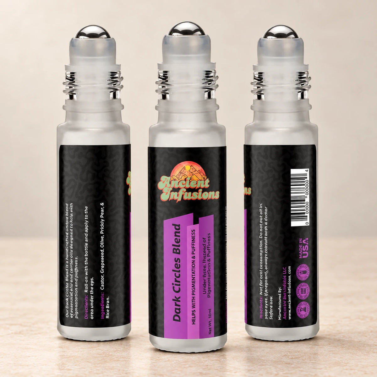 Ancient Infusions Dark Circles Herbal Remedy Oil Smooth & Restore front, side and back bottle views on a soft ivory stone background.