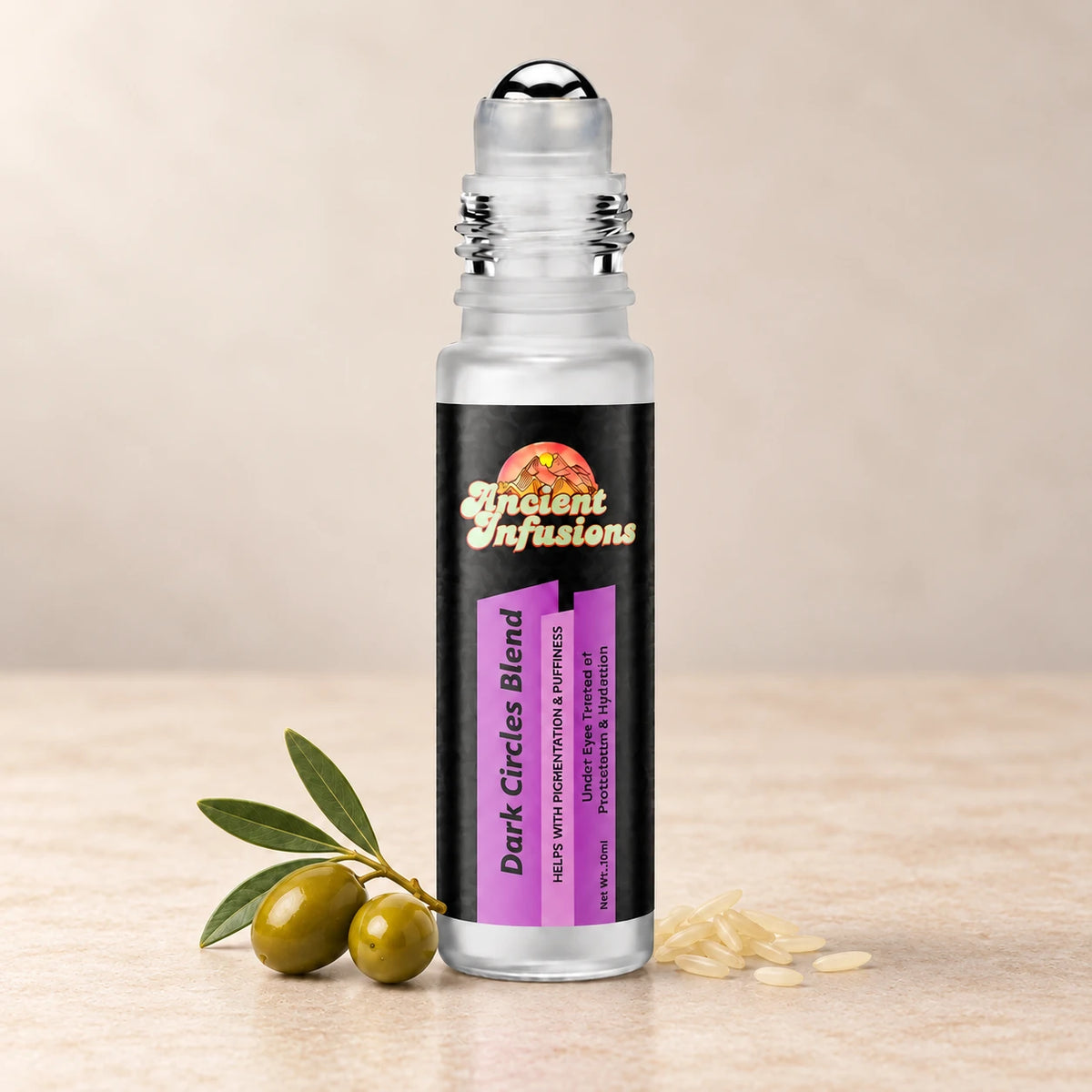 Ancient Infusions Dark Circles Herbal Remedy Oil Smooth & Restore single roller bottle with botanical accents on a soft ivory stone background.