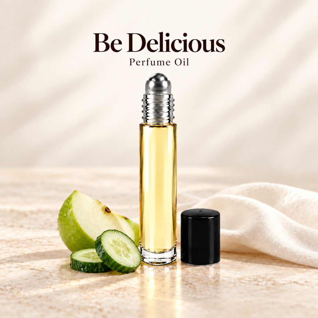 DKNY Be Delicious Perfume Oil with simple scent note accents on soft ivory