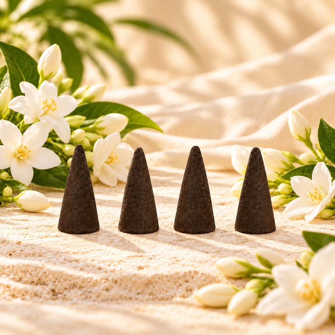 Egyptian Jasmine Incense Cones on cream stone.