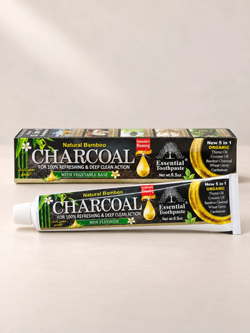 Essential Palace Bamboo Charcoal Toothpaste 5-in-1 fluoride-free toothpaste tube and box on a pale warm greige background.