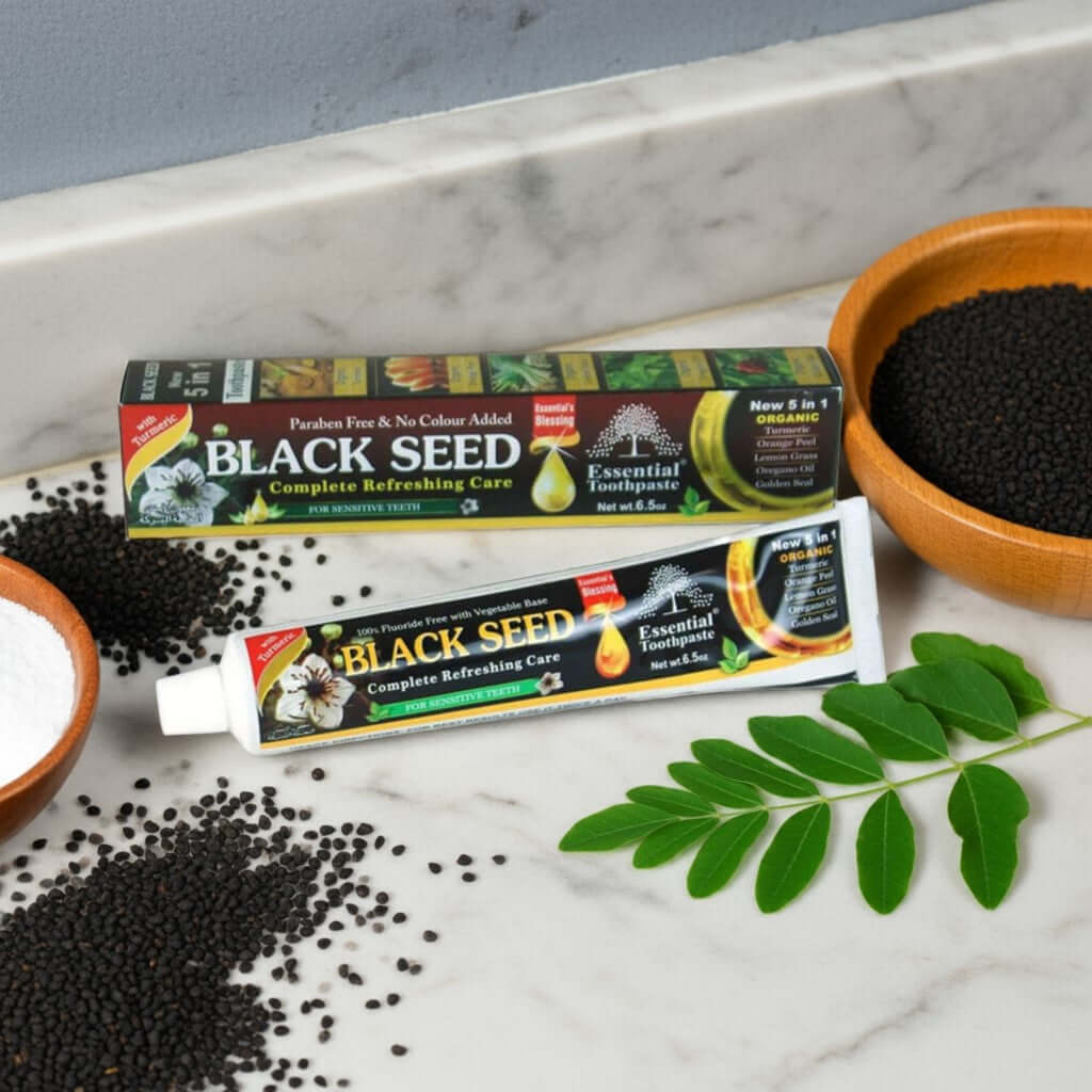 Essential Palace Black Seed 5-in-1 Fluoride-Free Toothpaste with black seeds, moringa, and herbs on marble counter