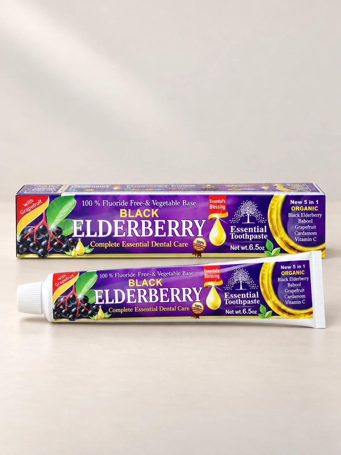Essential Palace Elderberry Toothpaste 5-in-1 fluoride-free toothpaste tube and box on a pale warm greige background.