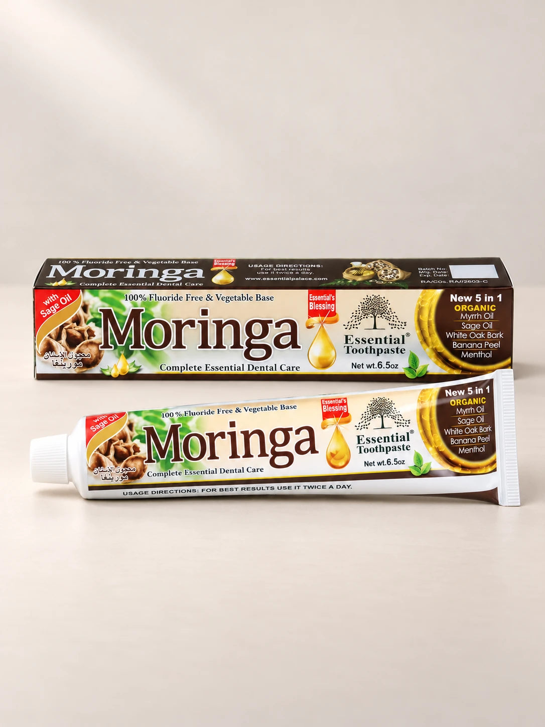 Essential Palace Moringa Toothpaste 5-in-1 fluoride-free toothpaste tube and box on a pale warm greige background.