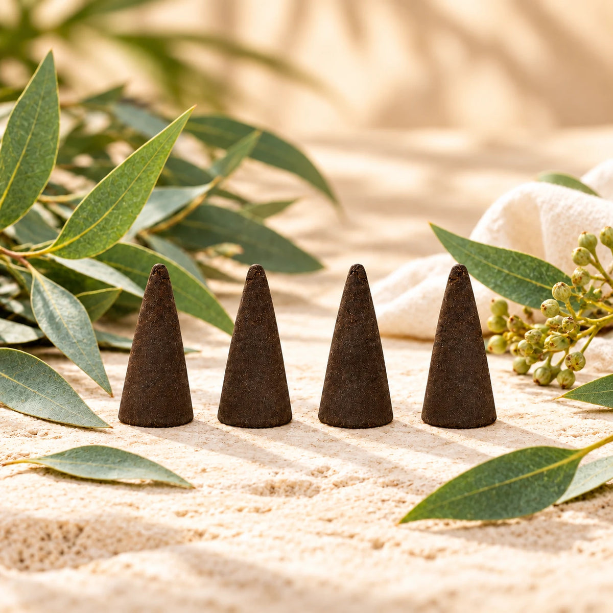 Eucalyptus Incense Cones on cream stone.
