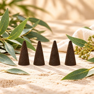 Eucalyptus Incense Cones on cream stone.