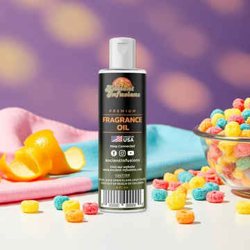 Bottle of Fruit Loops Fragrance Oil - Pure & Uncut surrounded by colorful cereal pieces and citrus peel.