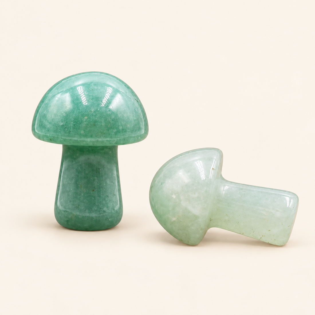 Green Aventurine Carved Mushroom with soft green tones on a soft ivory background