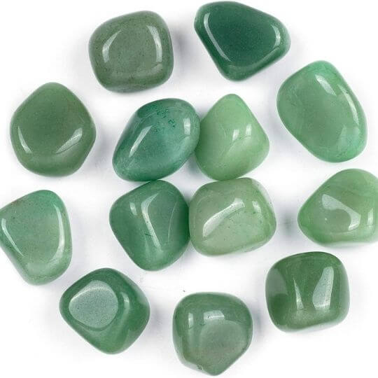 Natural Green Aventurine tumbled stones showcasing their vibrant hues and healing benefits