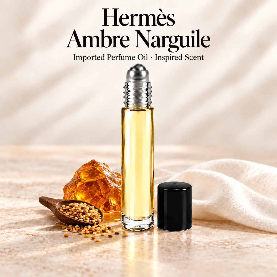 Hermès Ambre Narguile Perfume Oil in a slim glass roll-on bottle with a silver roller and black cap on an ivory stone surface.