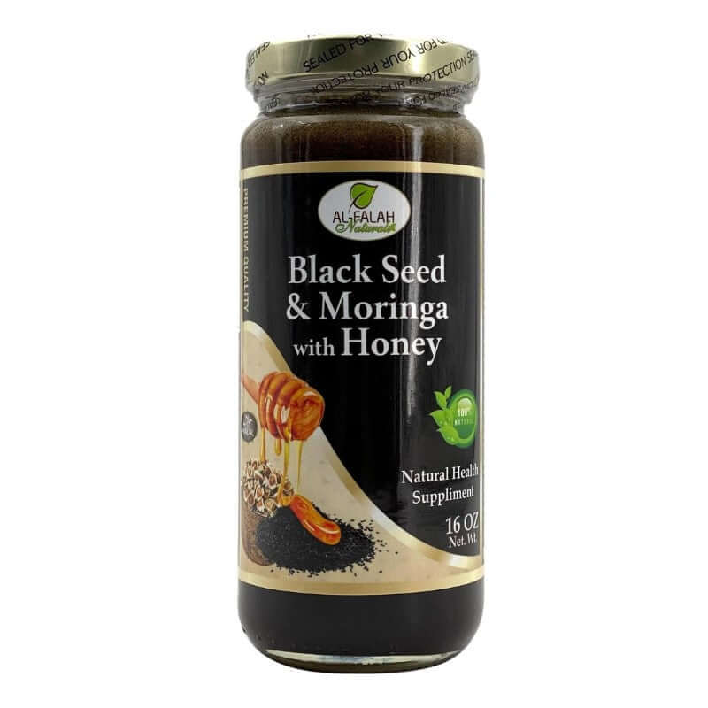 Jar of Black Seed & Moringa Herbal Honey with herbs on a white marble counter.