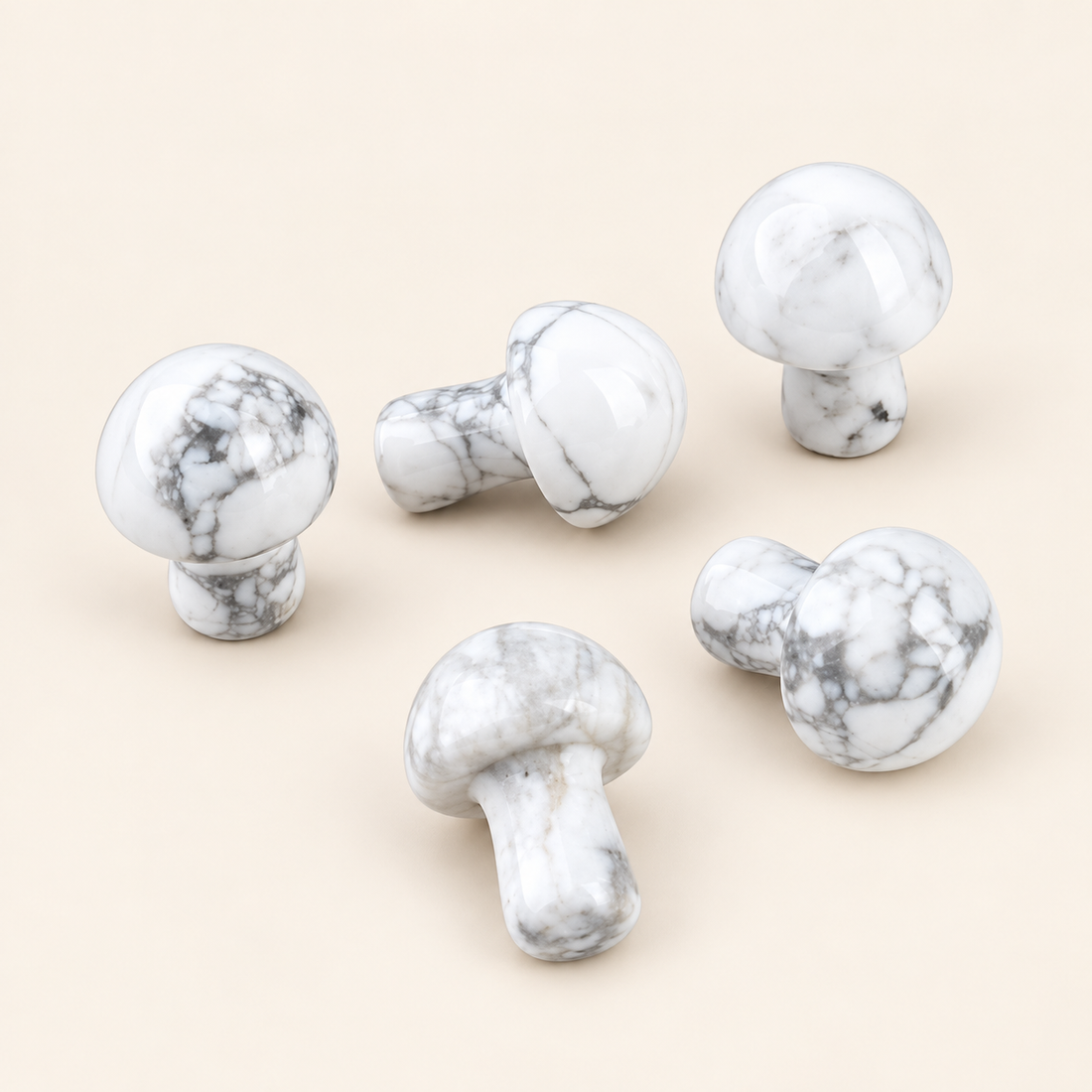 Howlite Carved Mushroom with white tones with gray veining on a soft ivory background