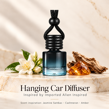 Hanging car diffuser inspired by Imported Alien Inspired, with scent illustrations on warm ivory stone