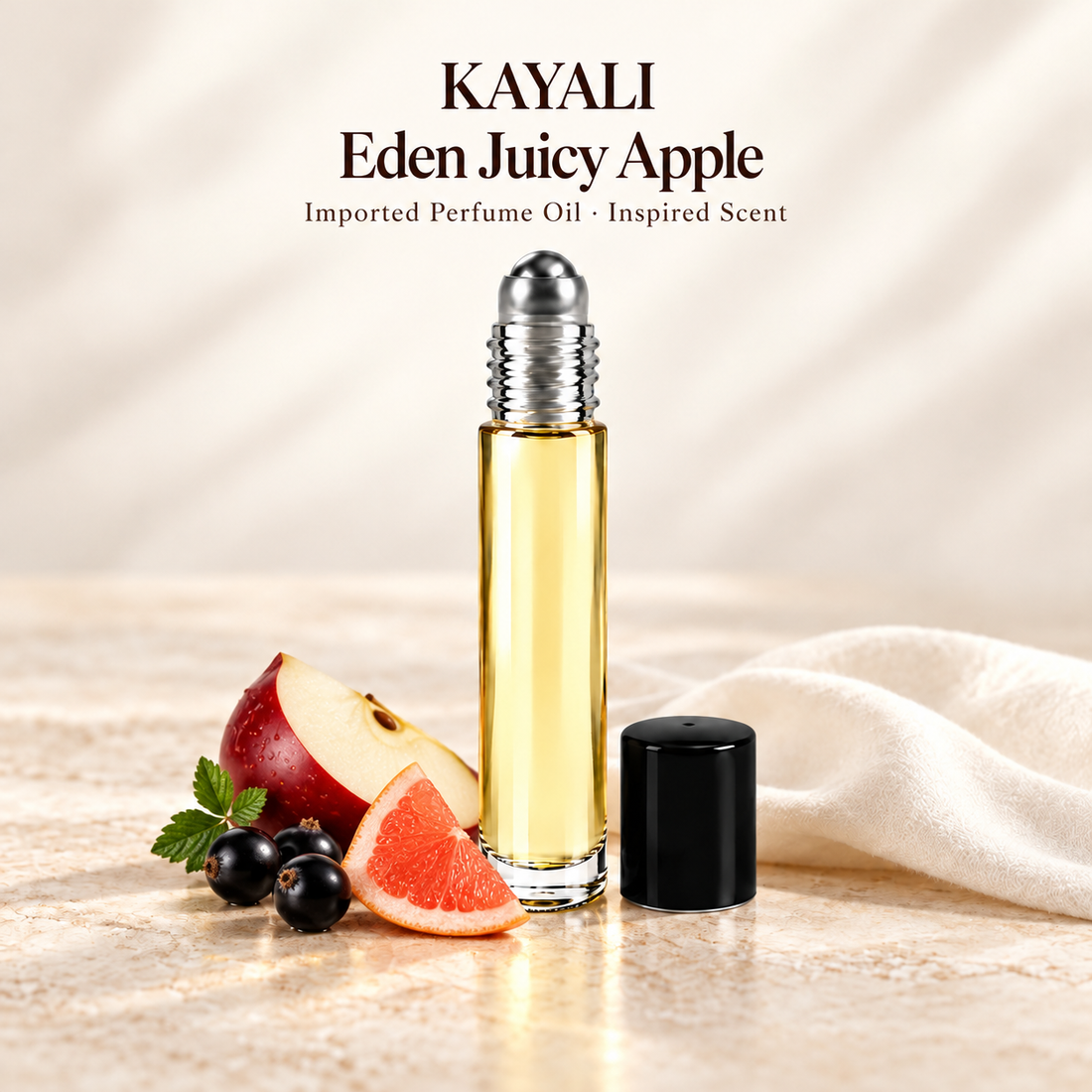 KAYALI Eden Juicy Apple Perfume Oil with minimal scent note accents on soft ivory