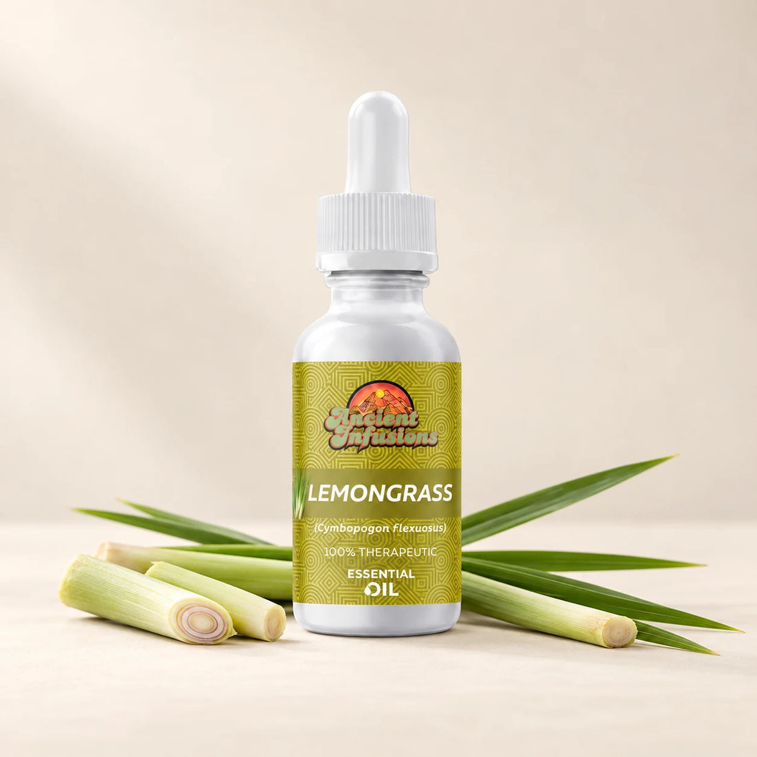 Ancient Infusions Lemongrass Essential Oil bottle with botanicals on a soft ivory background.