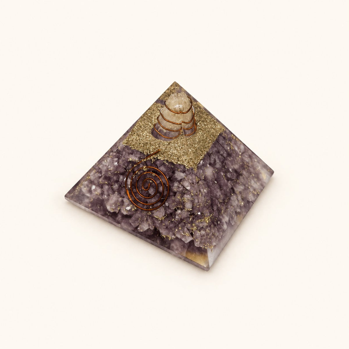 Lepidolite Orgone Pyramid with soft lilac lepidolite chips and metallic details on a warm ivory background