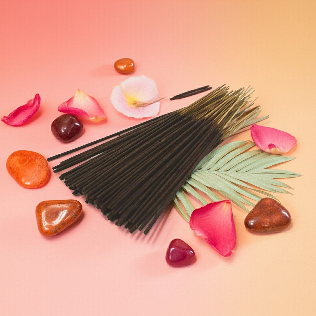 Lick Me All Over Incense Sticks with palm leaves and colorful stones on a gradient background