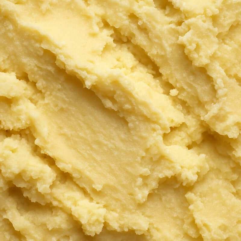 Close-up of creamy Lick Me All Over Scented Shea Butter texture, showcasing its rich, organic, unrefined ingredients.