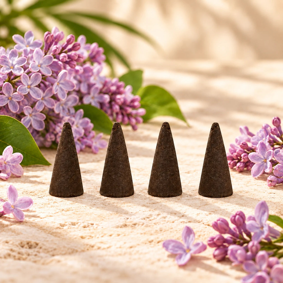 Lilac Incense Cones on cream stone.