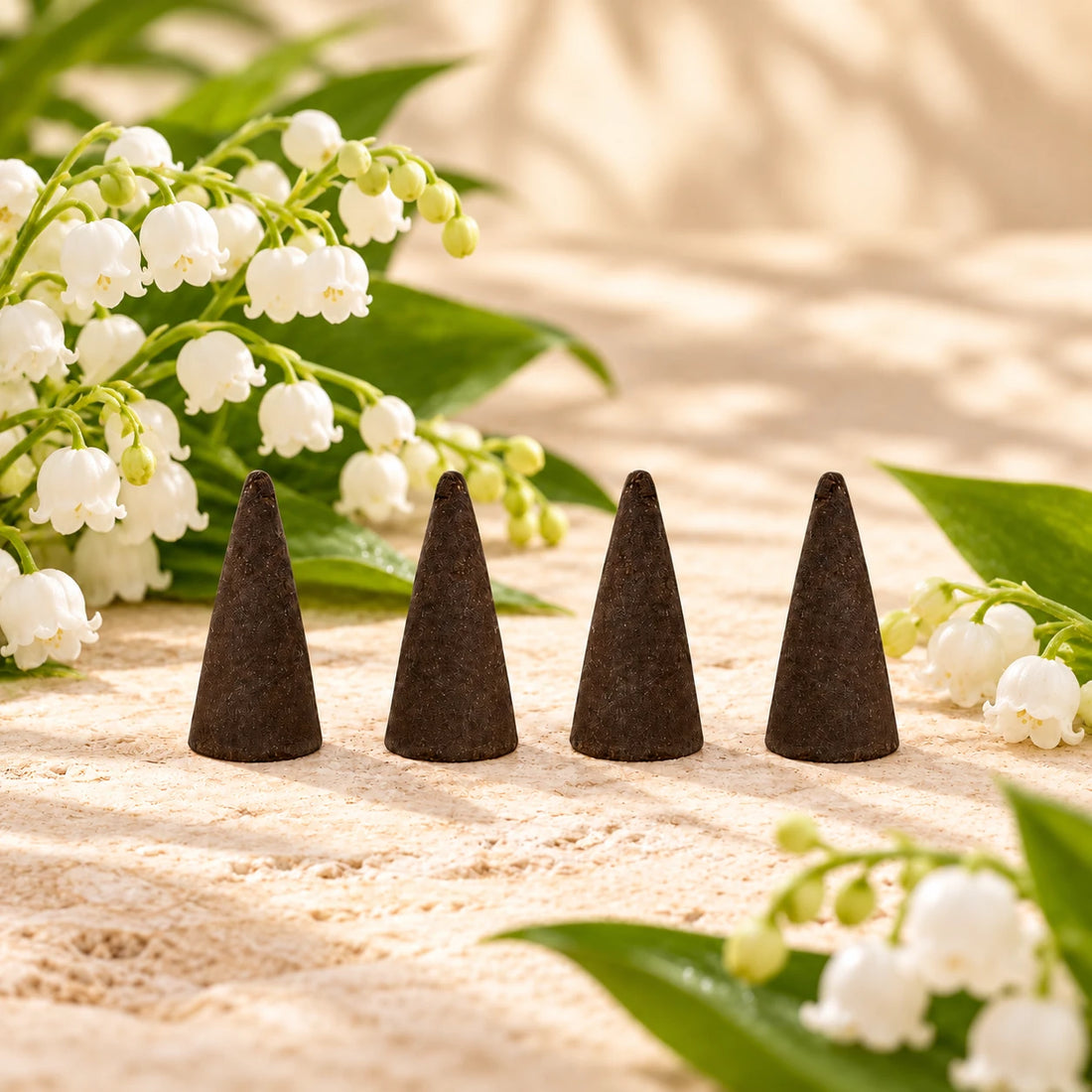 Lily of the Valley Incense Cones with lily of the valley flowers.