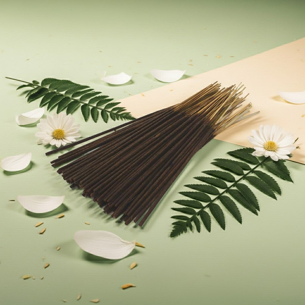 Lily of the Valley Incense Sticks with green leaves and white flowers on a light green background