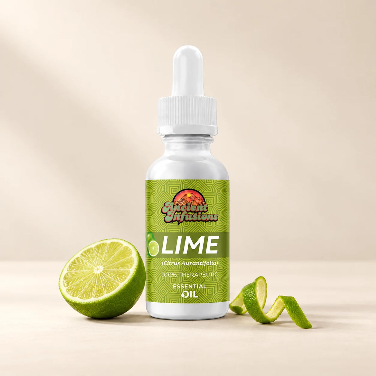 Ancient Infusions Lime Essential Oil bottle with botanicals on a soft ivory background.
