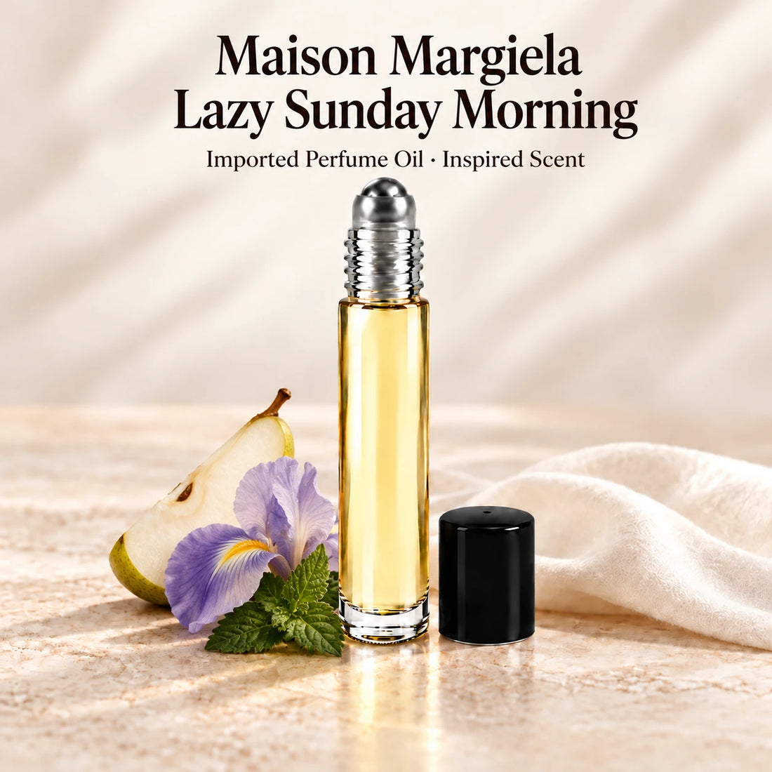 Maison Margiela Lazy Sunday Morning Perfume Oil in a slim glass roll-on bottle with a silver roller and black cap on an ivory stone surface.