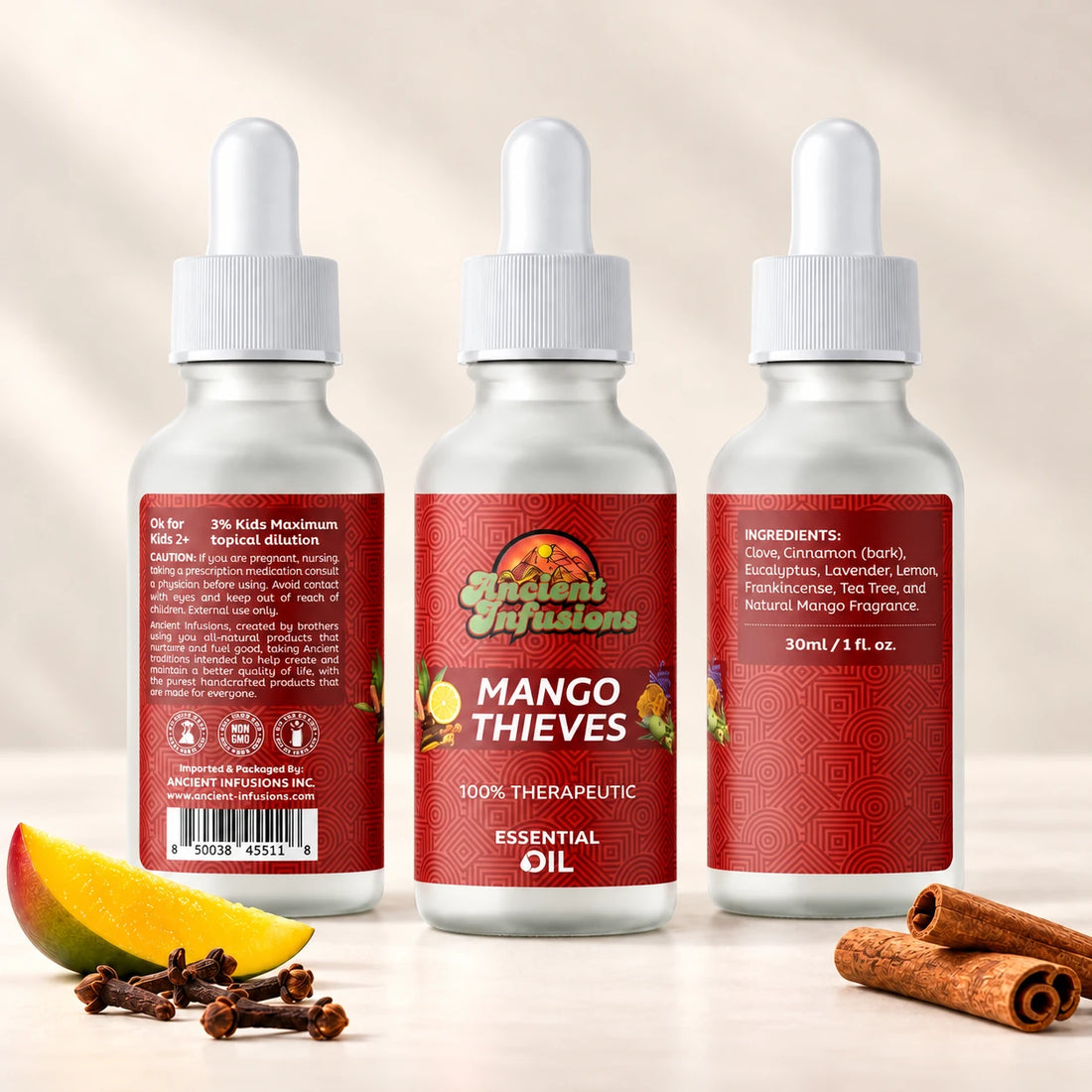 Ancient Infusions Mango Thieves Essential Oil Blend bottle with white dropper, mango, cinnamon and cloves on a soft ivory background.