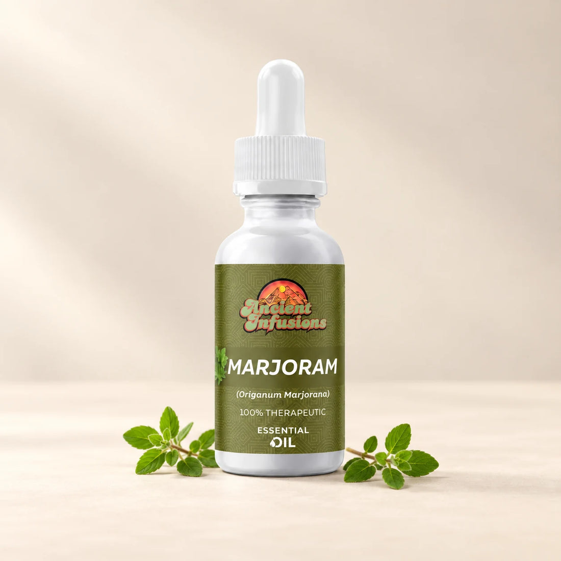 Ancient Infusions Marjoram Essential Oil bottle with botanicals on a soft ivory background.