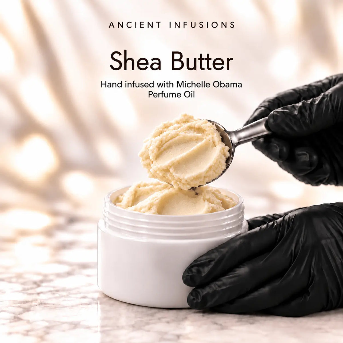 Black vinyl-gloved hands scoop raw shea butter hand infused with Michelle Obama inspired perfume oil.