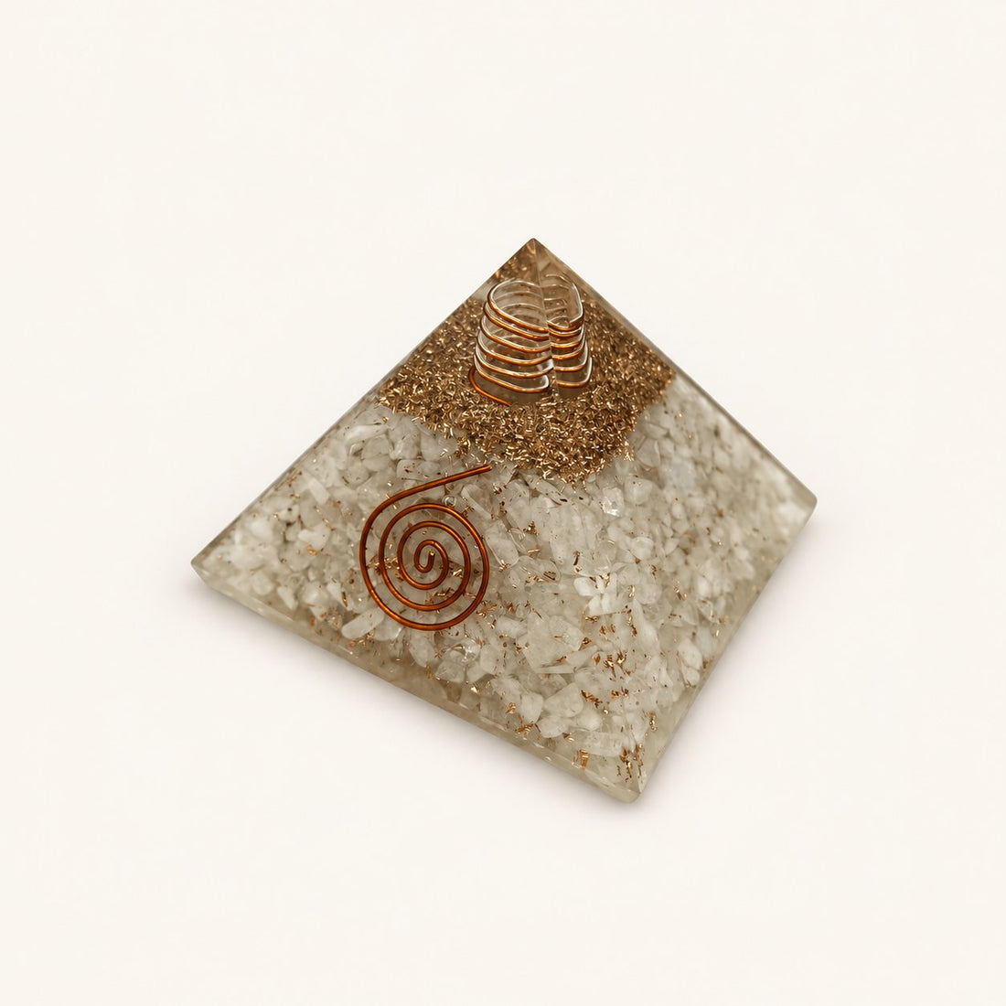 Moonstone Orgone Pyramid with soft ivory moonstone chips and metallic details on a warm ivory background