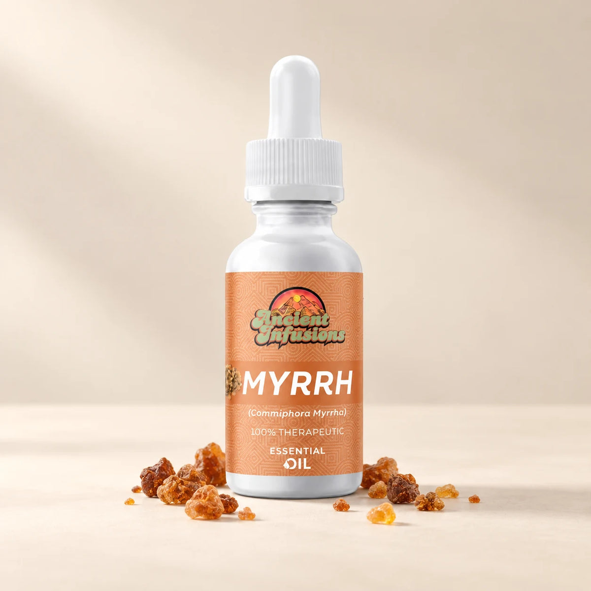 Ancient Infusions Myrrh Essential Oil bottle with botanicals on a soft ivory background.