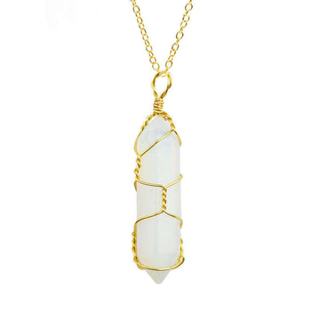 Close-up of an Opalite Necklace featuring a glowing gemstone wrapped in handcrafted gold wire with a stainless steel chain.