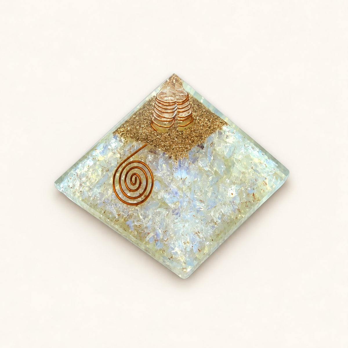 Opalite Orgone Pyramid with luminous, opalescent opalite chips and metallic details on a warm ivory background
