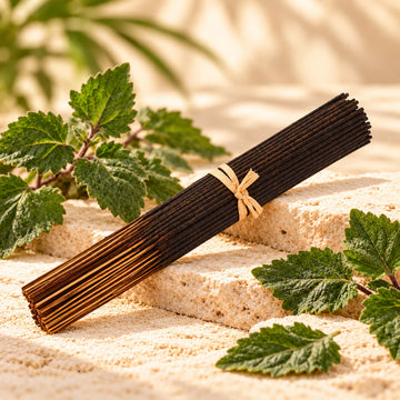 Patchouli Incense Sticks on cream stone.