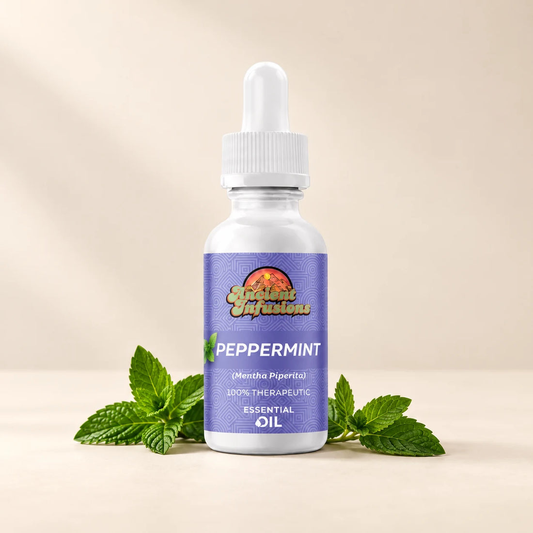 Ancient Infusions Peppermint Essential Oil bottle with botanicals on a soft ivory background.