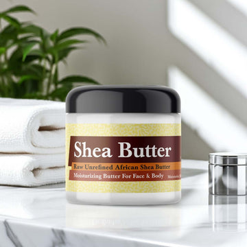 Chanel No 5 Inspired Scented Shea Butter in bathroom setting with plants and towels