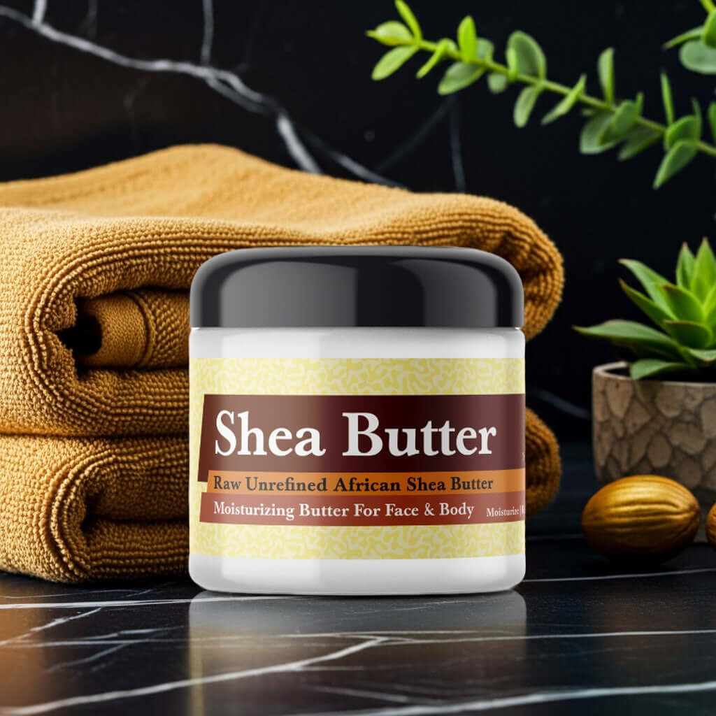 Jay Z Gold Inspired Scented Shea Butter in a jar on spa setting with towels and leaves
